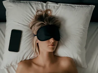 Person falling asleep listening on phone